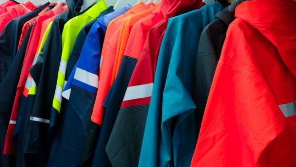 Image of colorful corporate apparel hanging on a rack
