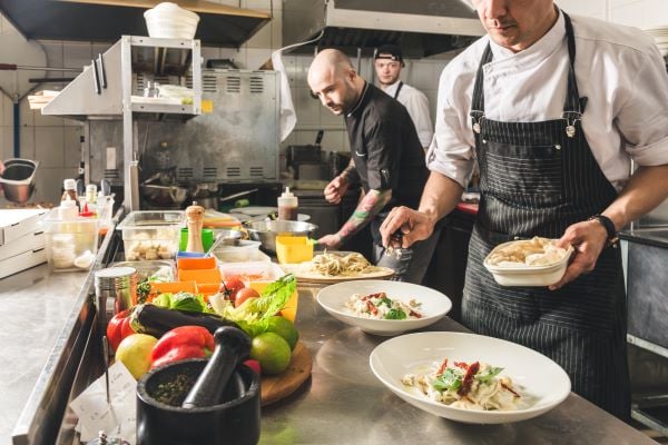 Image of chefs working in a restaurant chain kitchen